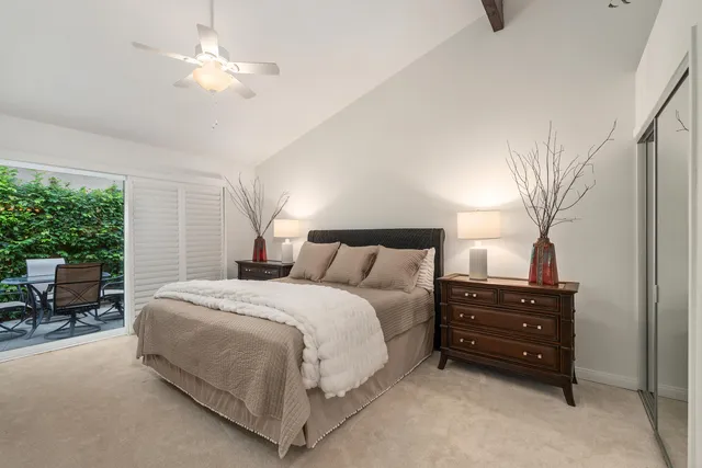 a bedroom with a bed and a television