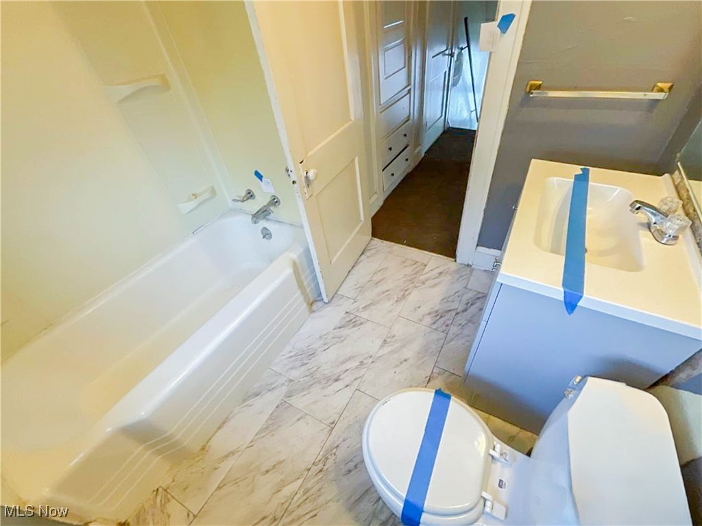14703 Granger Road Maple Heights, OH 44137 - Photo 25 of 35 Full bath featuring toilet, marble finish floor, and vanity