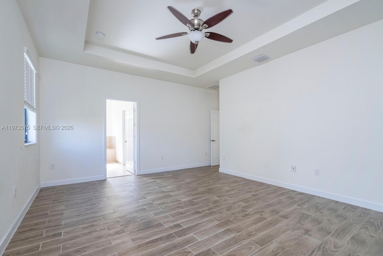 516 Southeast 35th Terrace Homestead, FL 33033 - Photo 12 of 25 wooden floor in an empty room
