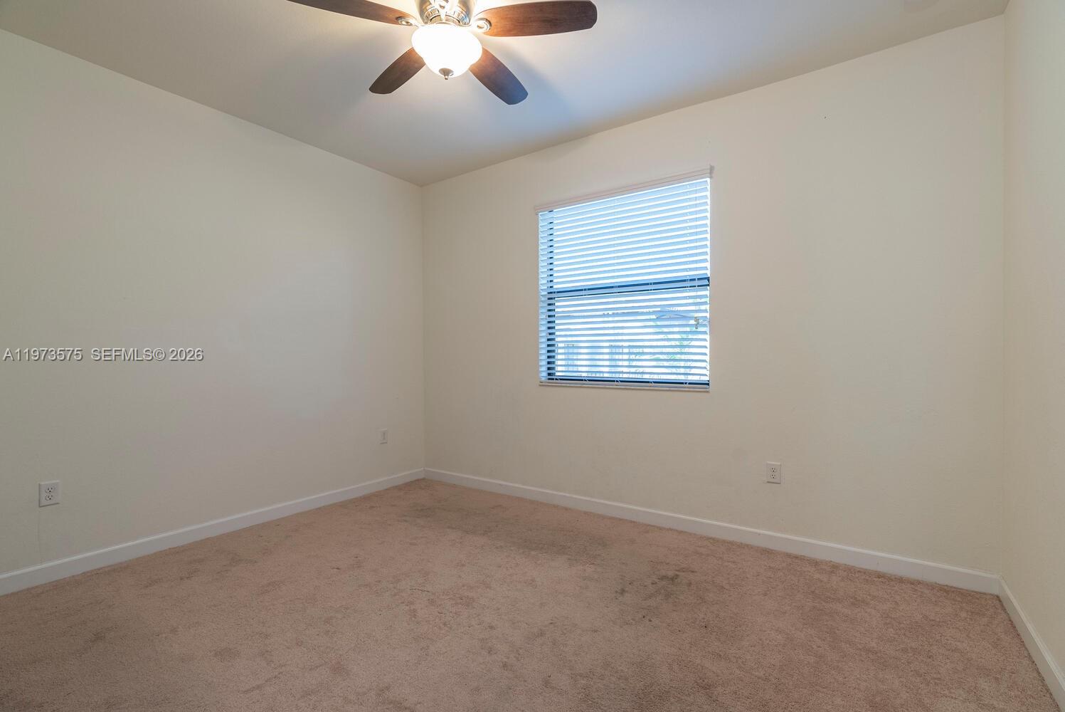 516 Southeast 35th Terrace Homestead, FL 33033 - Photo 19 of 25 an empty room with a window
