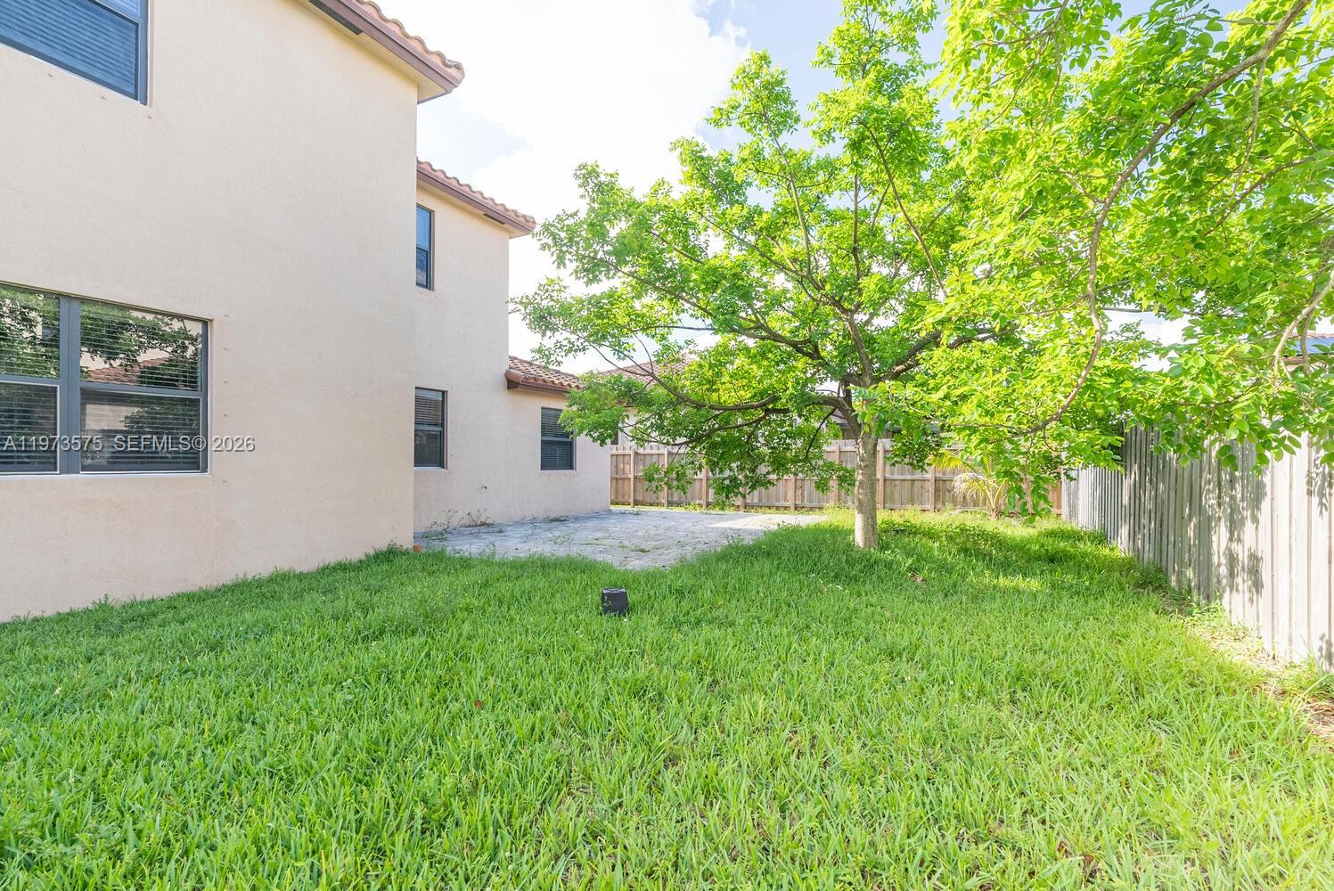 516 Southeast 35th Terrace Homestead, FL 33033 - Photo 25 of 25 a view of backyard with large trees