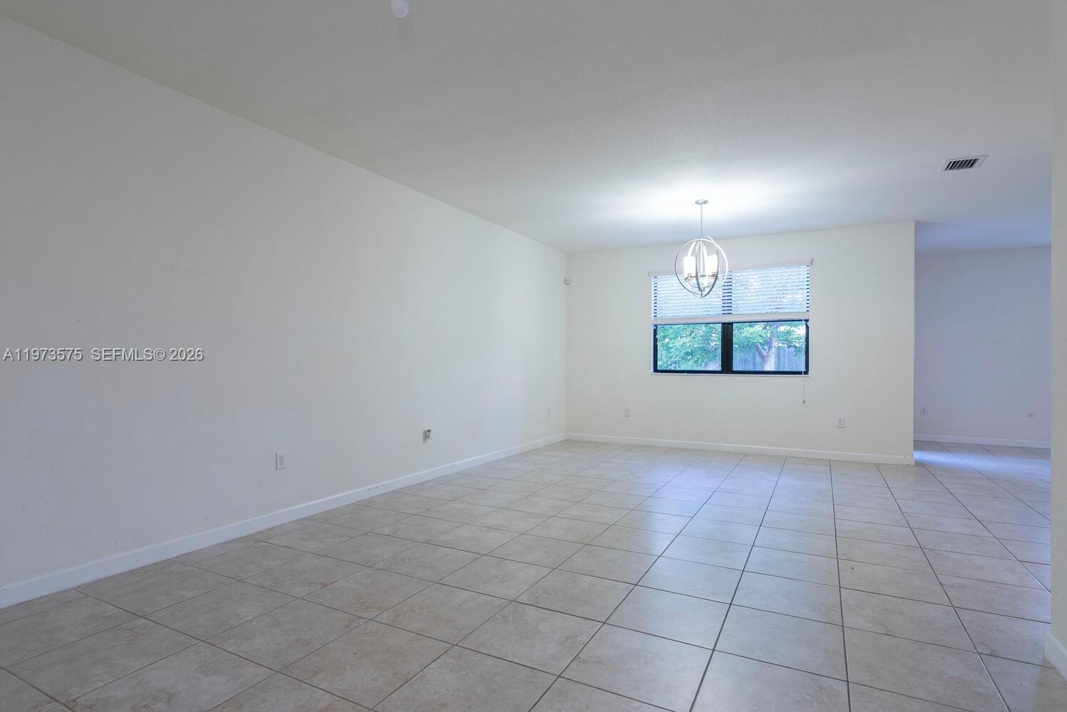 516 Southeast 35th Terrace Homestead, FL 33033 - Photo 5 of 25 an empty room with windows