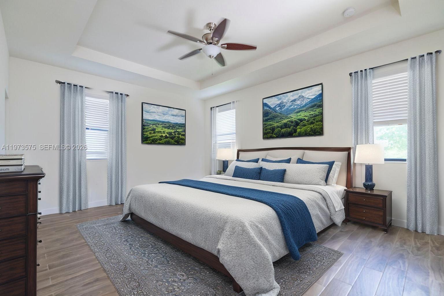 516 Southeast 35th Terrace Homestead, FL 33033 - Photo 10 of 25 a bedroom with bed and a chandelier