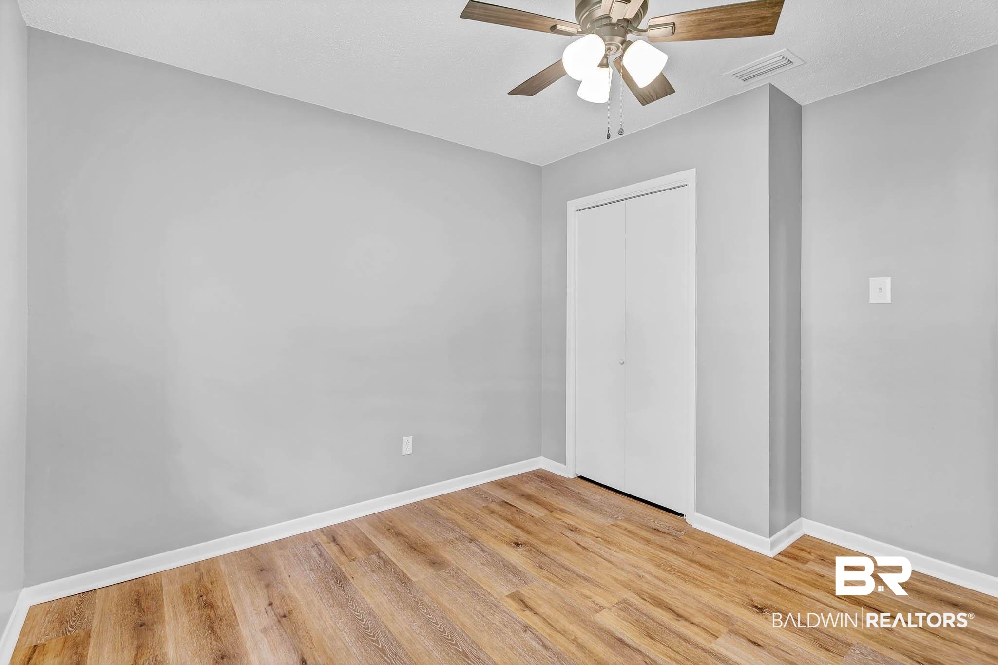 3304 Armond Drive Mobile, AL 36605 - Photo 34 of 62 Unfurnished bedroom with light wood-type flooring, a closet, and ceiling fan