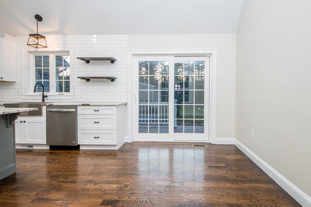 61 Ryder Road Rochester, MA 02770 - Photo 12 of 25 a view of a kitchen with wooden floor and a window