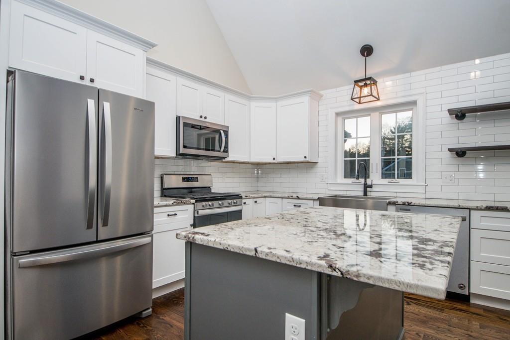 61 Ryder Road Rochester, MA 02770 - Photo 13 of 25 a kitchen with stainless steel appliances granite countertop a refrigerator sink and microwave