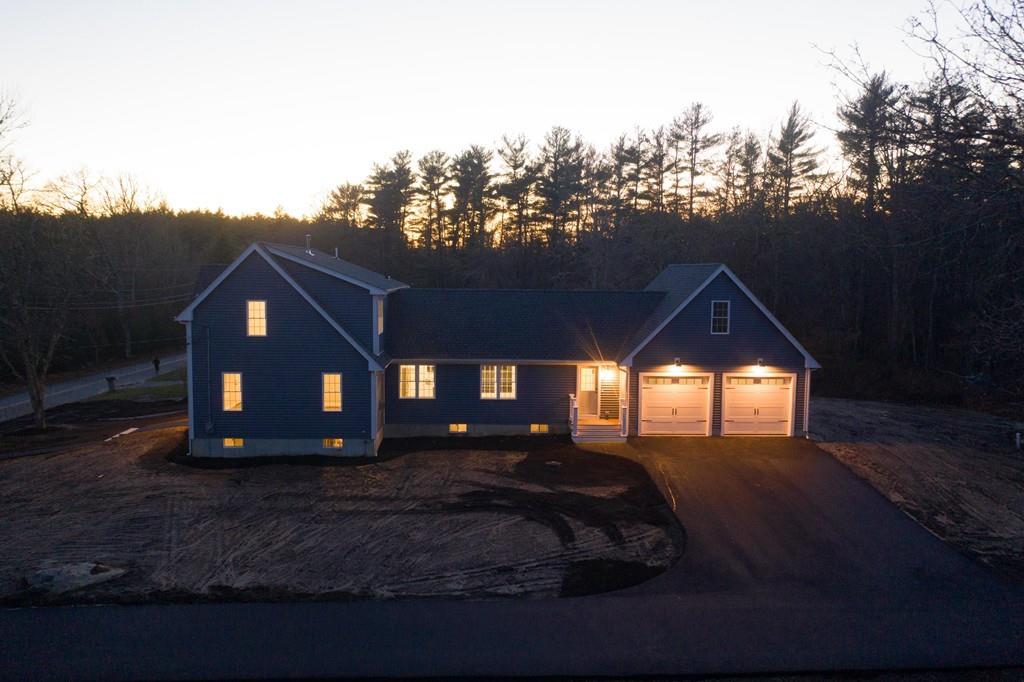 61 Ryder Road Rochester, MA 02770 - Photo 3 of 25 a front view of a house with a yard