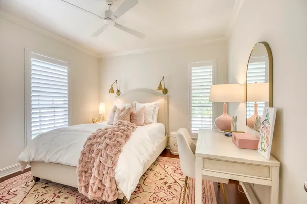 a bedroom with bed and window