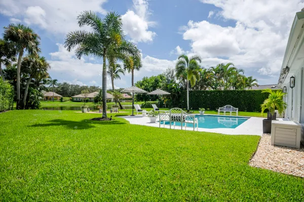 a view of a chair and tables in the garden