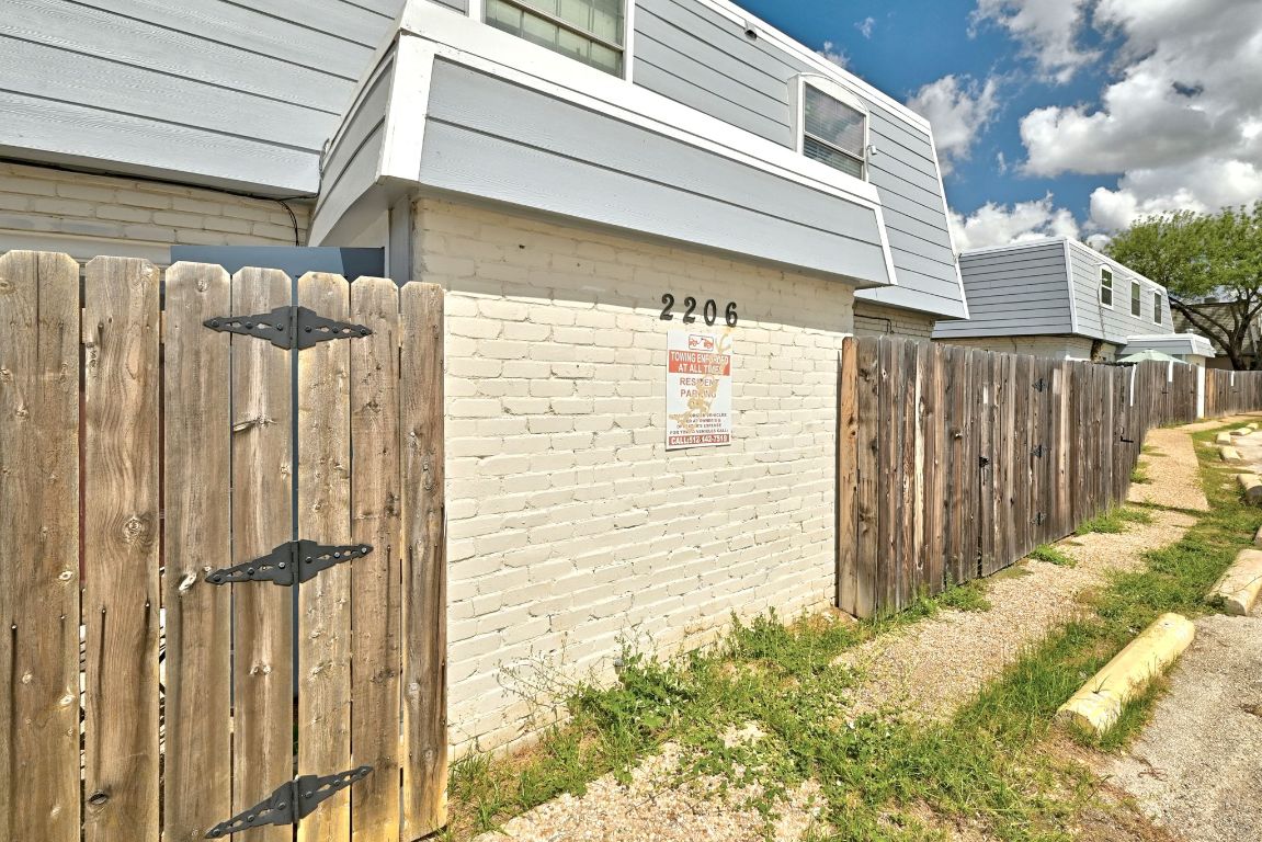 2208 Mission Hill Drive, Unit 103 Austin, TX 78741 - Photo 5 of 26 a view of a pathway of a building