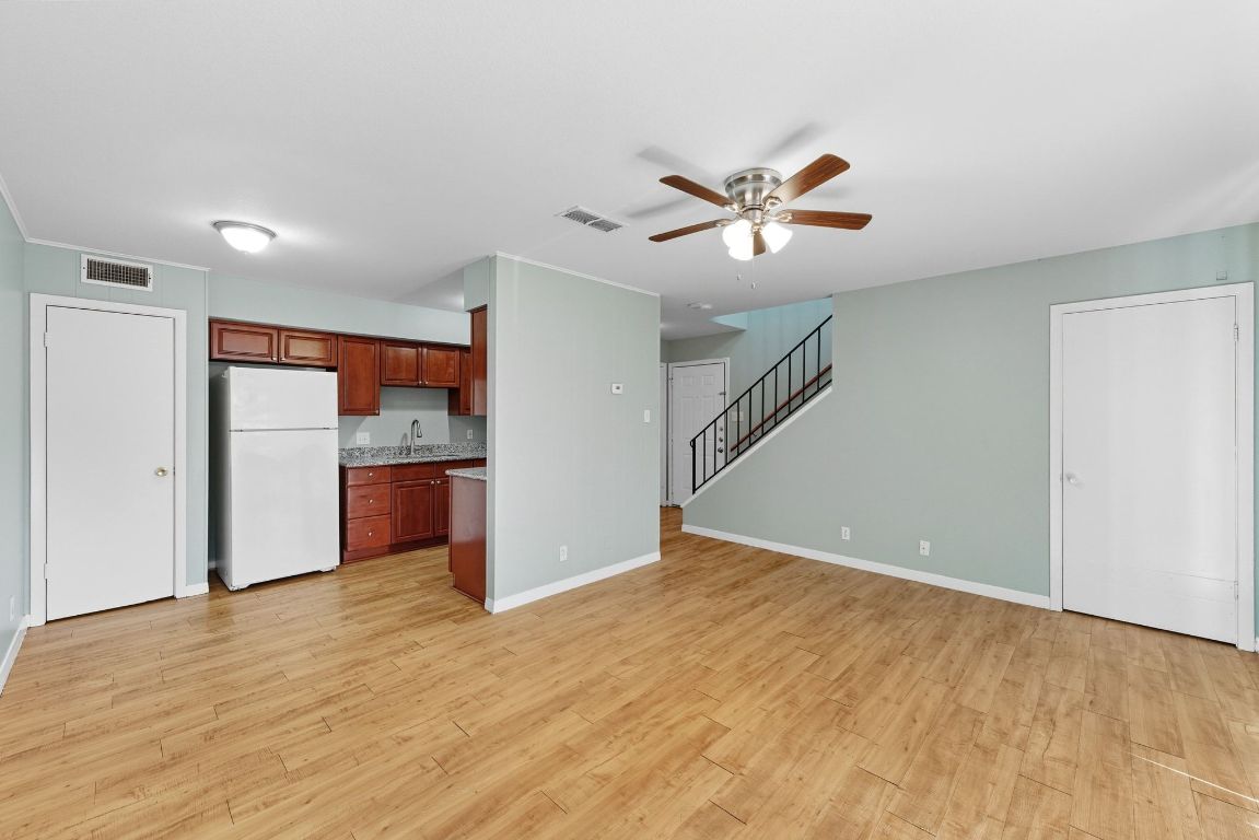 2208 Mission Hill Drive, Unit 103 Austin, TX 78741 - Photo 8 of 26 a view of a kitchen with a dishwasher and a kitchen view