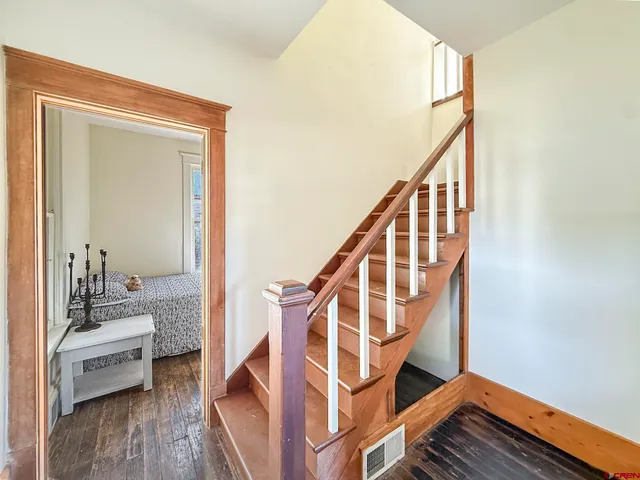 a view of an entryway with wooden floor