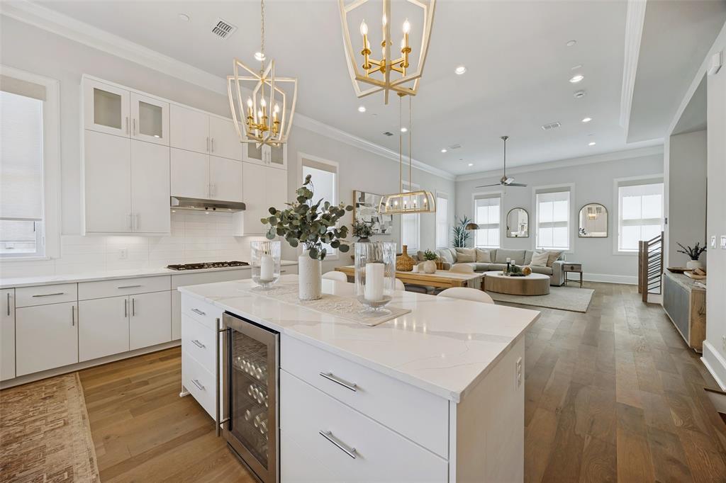 a large kitchen with a sink a counter space and appliances