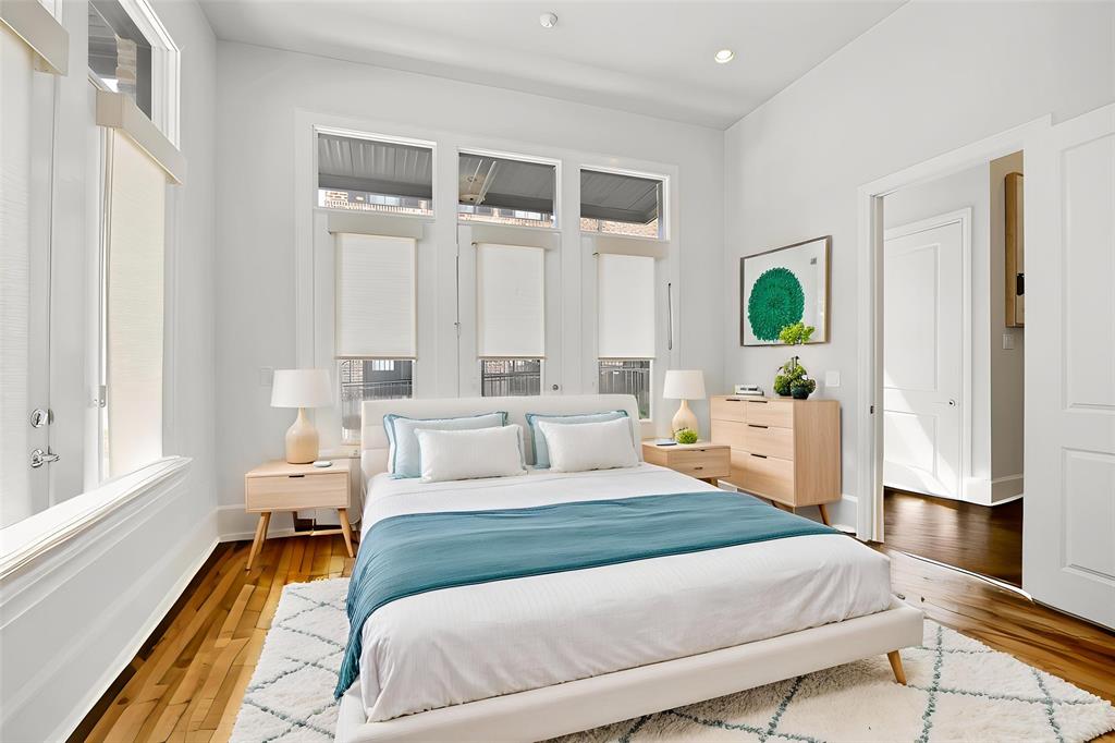 15015 Oak Street Addison, TX 75001 - Photo 12 of 33 a bedroom with a bed window and potted plant
