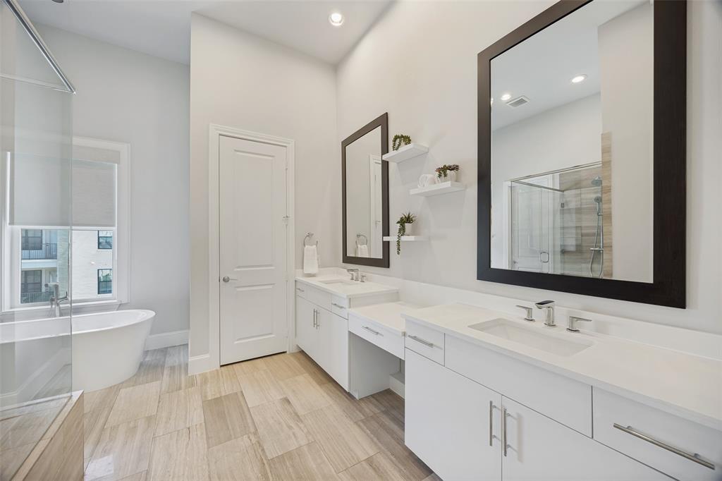 15015 Oak Street Addison, TX 75001 - Photo 17 of 33 a spacious bathroom with a double vanity sink mirror and double