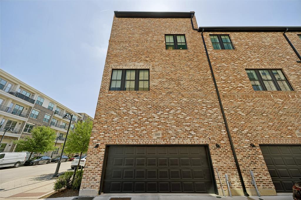 15015 Oak Street Addison, TX 75001 - Photo 26 of 33 a view of a brick wall of the building