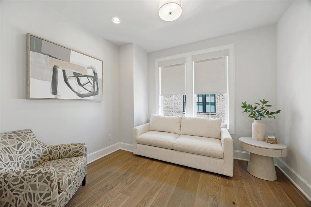15015 Oak Street Addison, TX 75001 - Photo 30 of 33 a living room with furniture and wooden floor