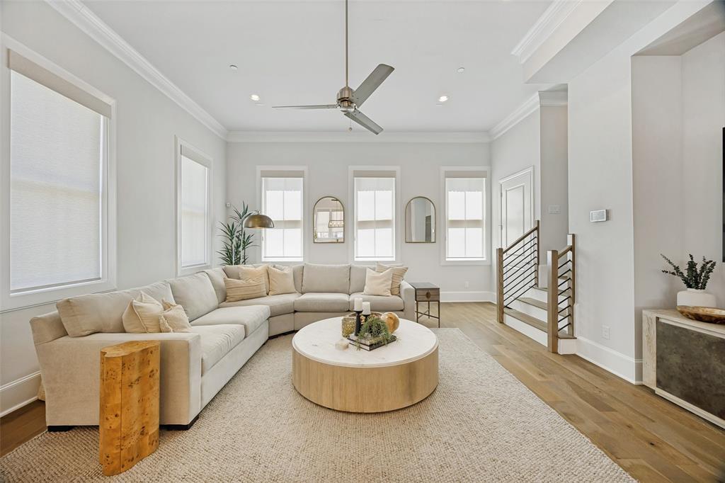 15015 Oak Street Addison, TX 75001 - Photo 7 of 33 a living room with furniture and a dining table
