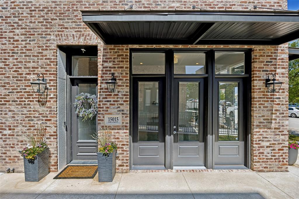 15015 Oak Street Addison, TX 75001 - Photo 8 of 33 a view of a brick house with a large window