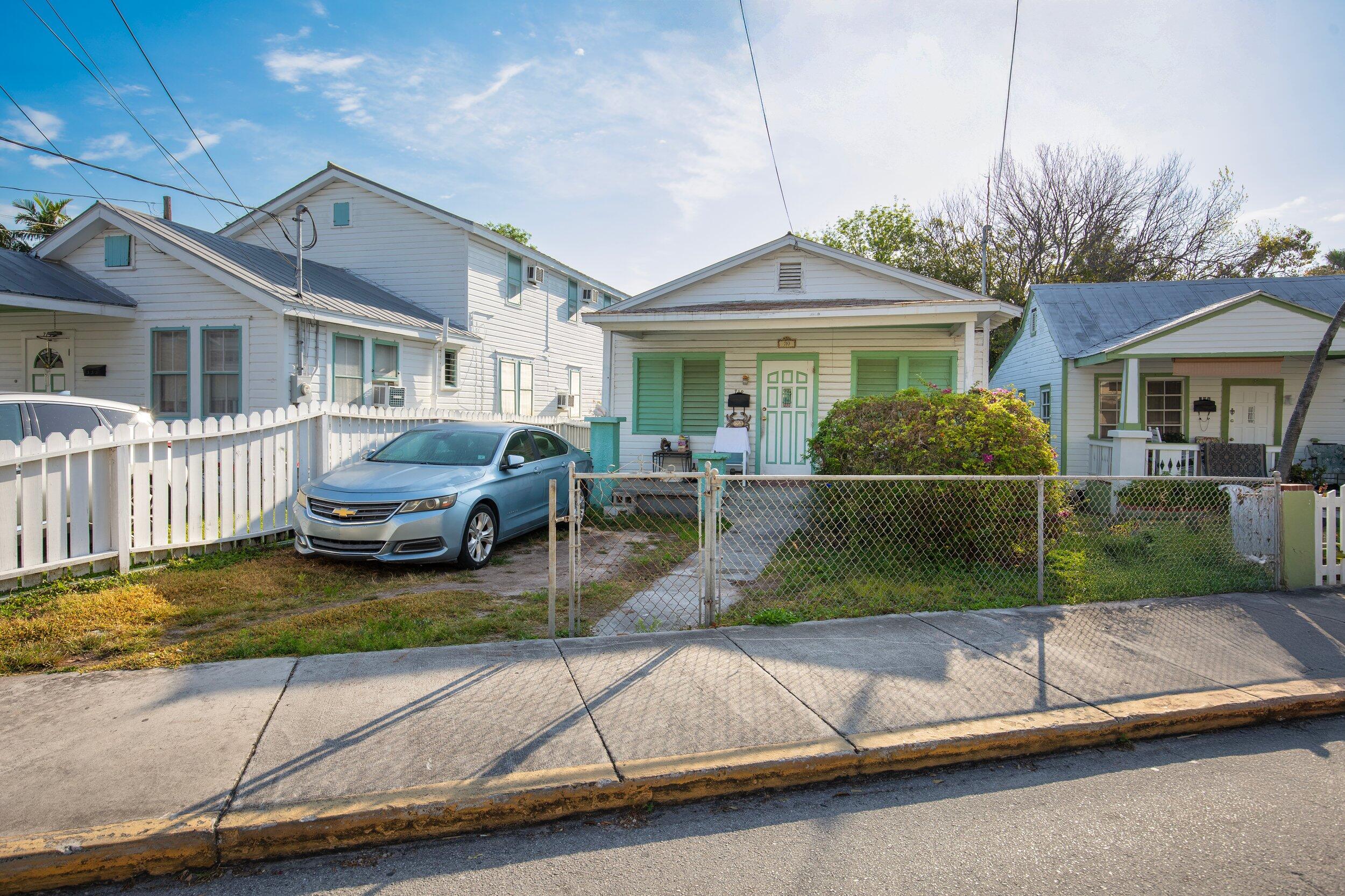 a view of a house with pool table and chairs