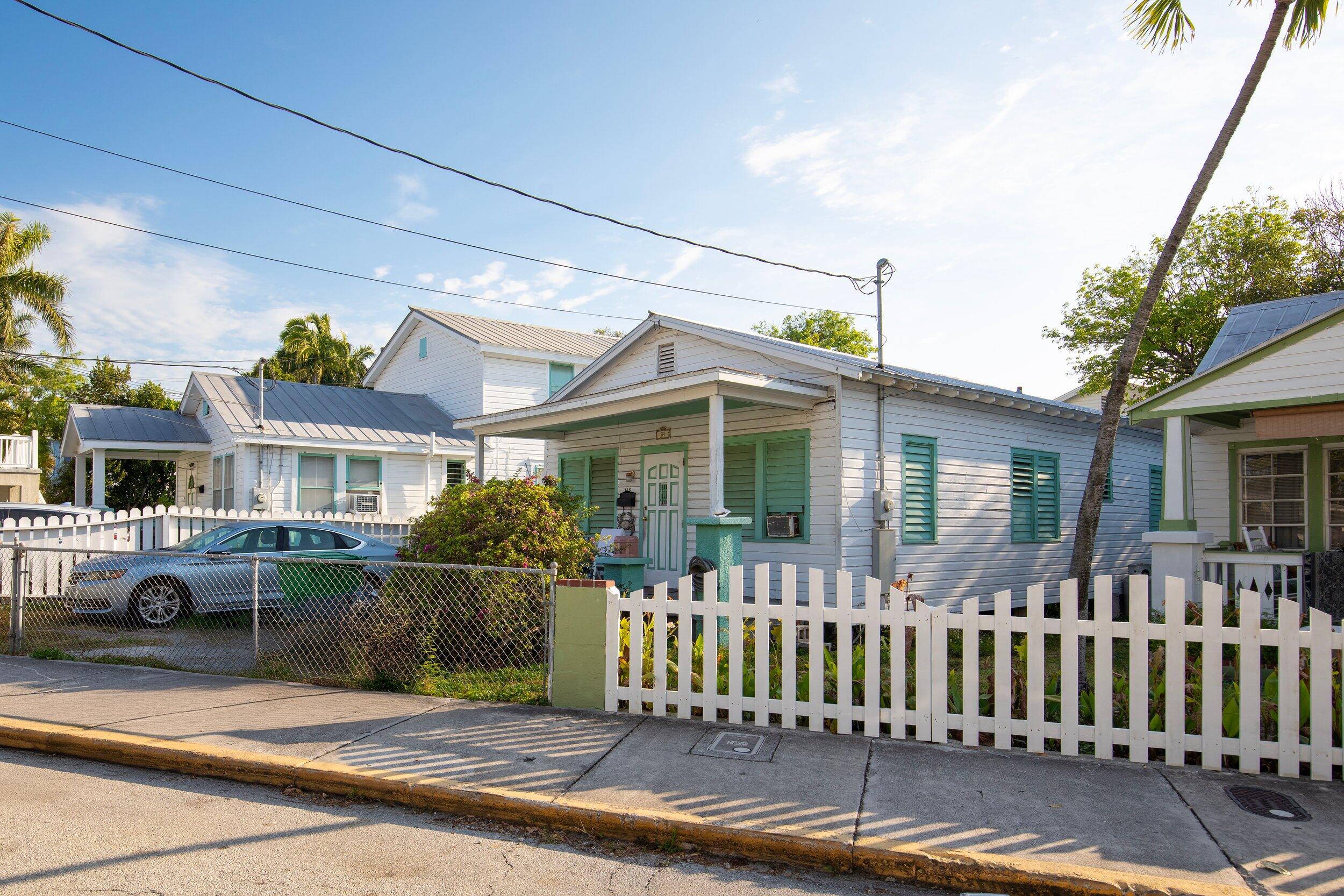719 Elizabeth Street Key West, FL 33040 - Photo 2 of 15 a front view of a house with a garden