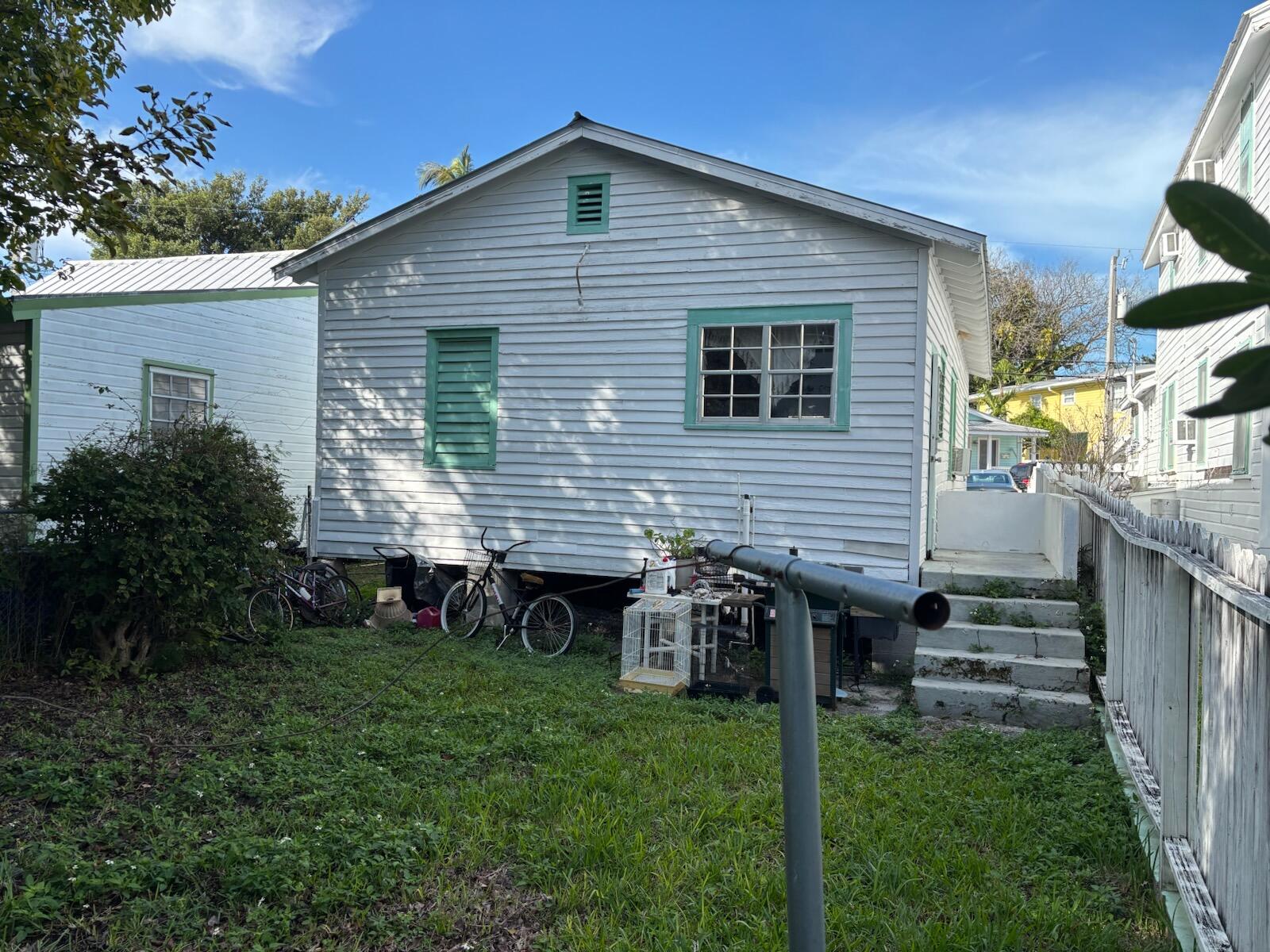 719 Elizabeth Street Key West, FL 33040 - Photo 3 of 15 a front view of house with yard and green space