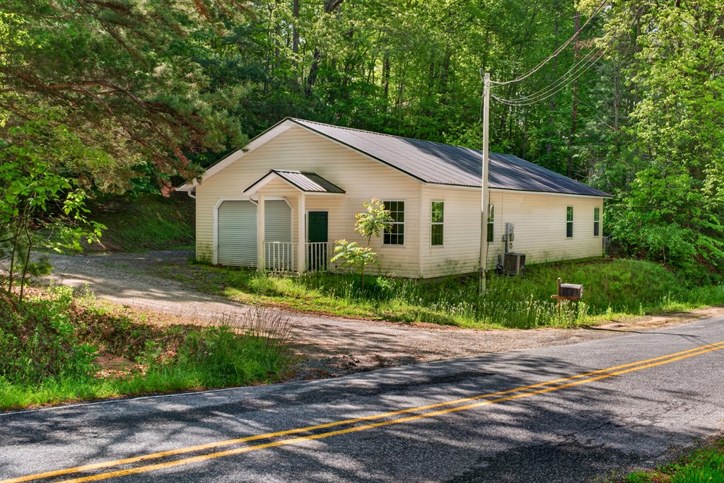 282 West Cherry Road Hayesville, NC 28904 - Photo 4 of 45 a view of a yard in front of a house with large trees