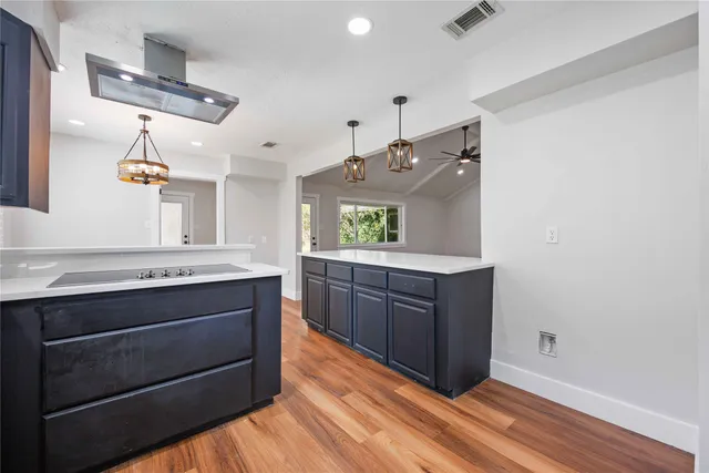 a kitchen with a stove and a sink