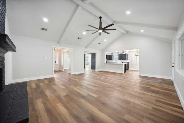 a view of a kitchen with a dishwasher kitchen stove and cabinets