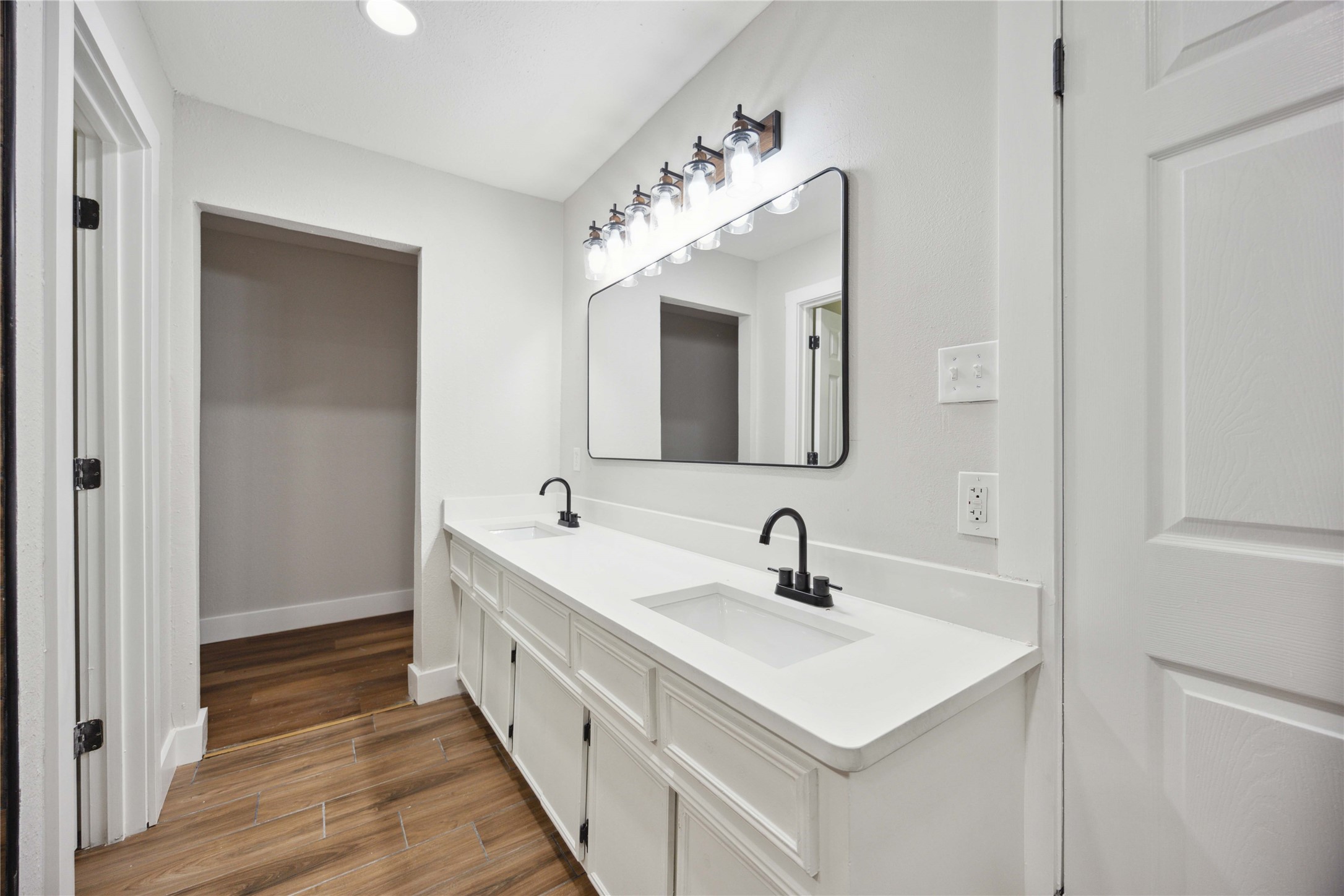 7907 12 Fairway Lane Humble, TX 77346 - Photo 34 of 42 a bathroom with a sink and a mirror