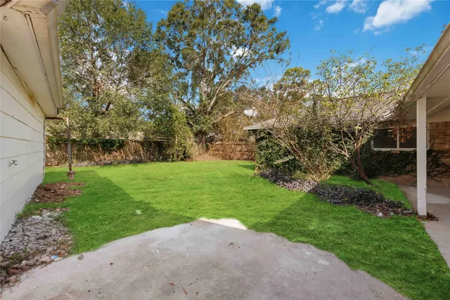 a view of a backyard with a garden