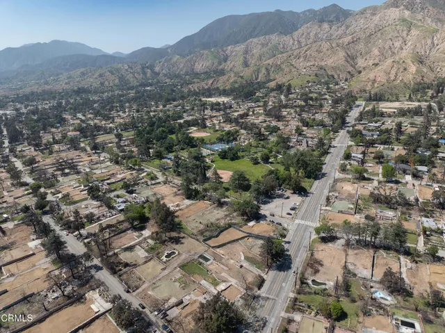 an aerial view of residential house with parking space
