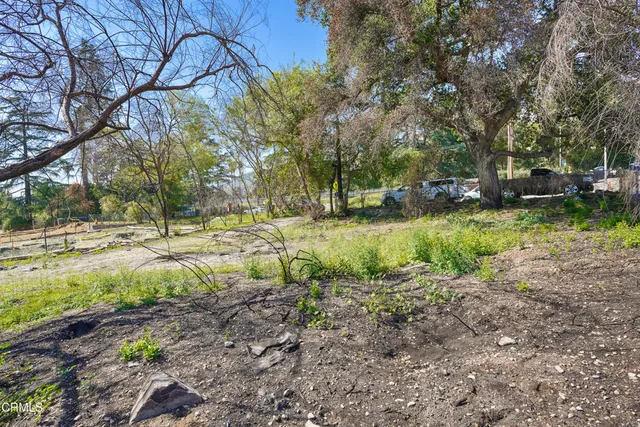 a backyard of a house with a yard and lake view