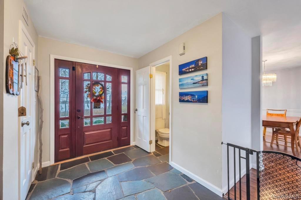 39 Bevin Road Northport, NY 11768 - Photo 8 of 44 Foyer entrance featuring baseboards and stone tile flooring