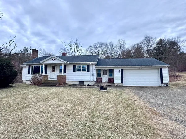 a front view of a house with yard