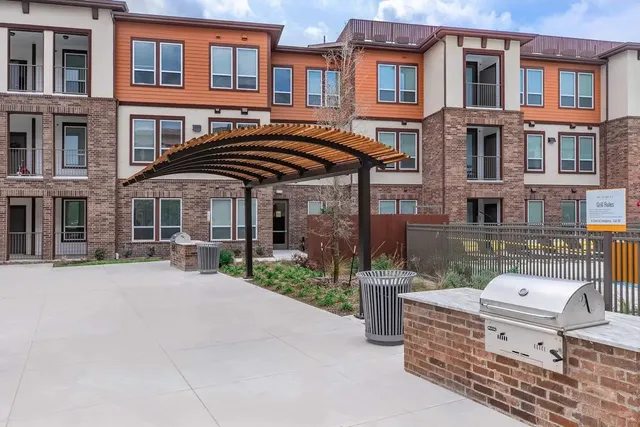 a front view of a building with many windows