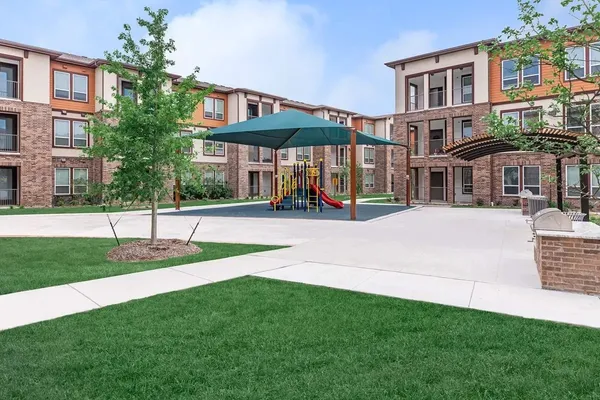 a view of a building with a yard