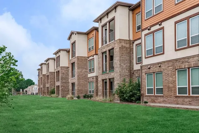 front view of a building with a yard