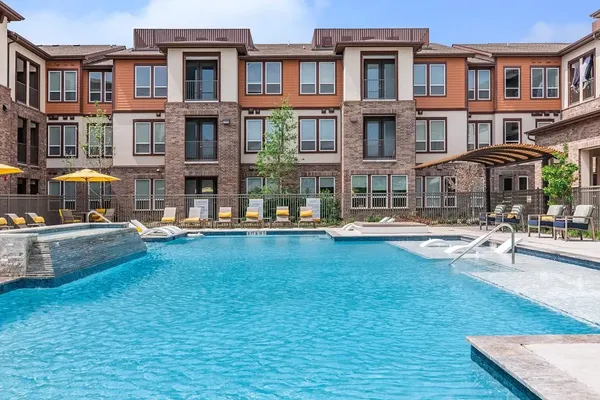 a swimming pool view with a outdoor seating