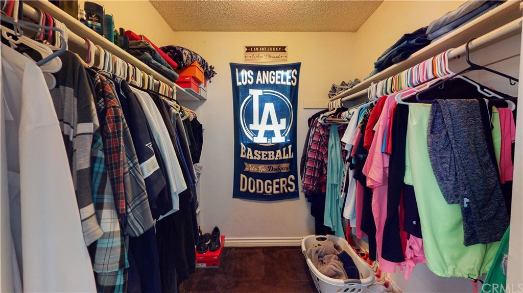 365 East Vodden Street Rialto, CA 92376 - Photo 26 of 37 The walk in closet in the master bedroom features lots of space and a window.