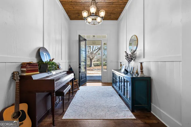 a large kitchen with stainless steel appliances cabinets a sink and a stove