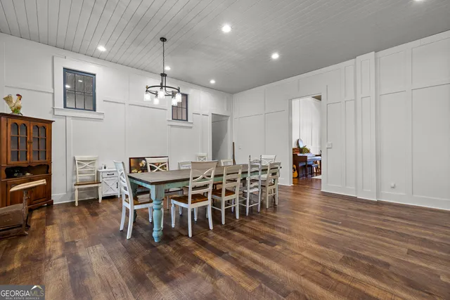 a living room with furniture fireplace and wooden floor