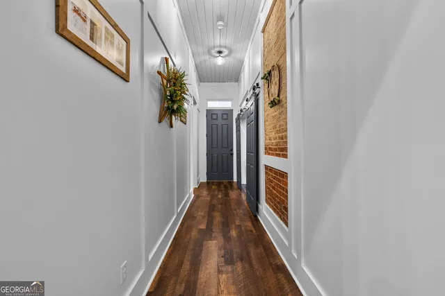a living room with furniture window and wooden floor