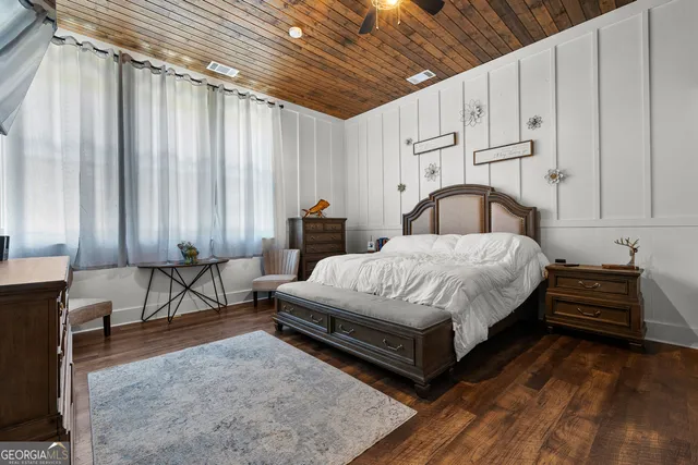 a bathroom with a sink mirror and vanity