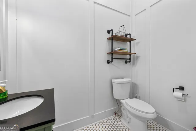 a bedroom with furniture and a flat screen tv