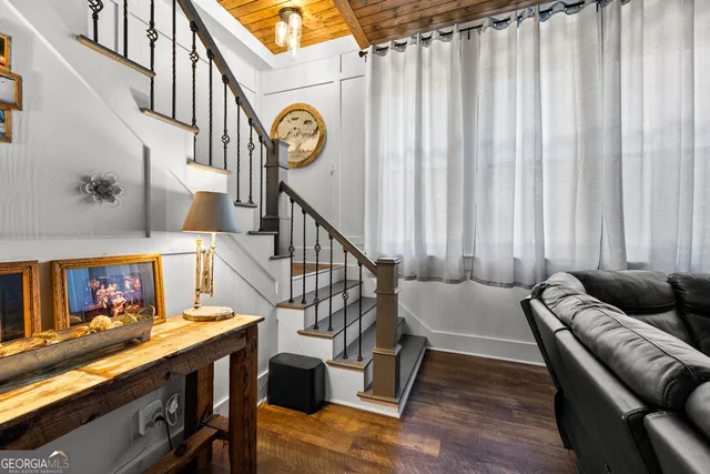 a view of a room with wooden floor