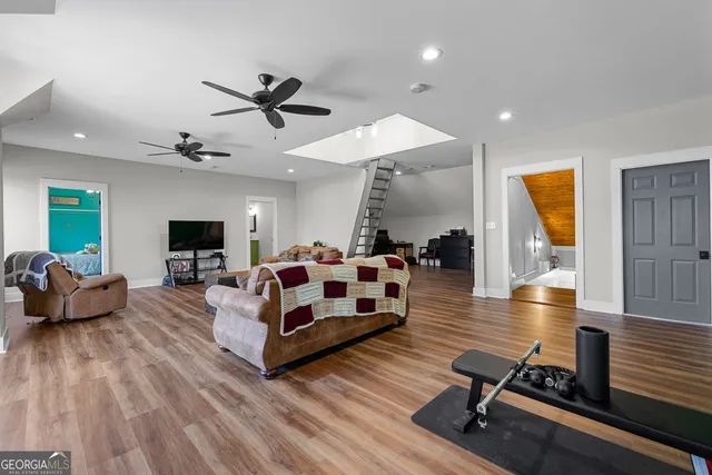 a view of a house with a yard covered in snow