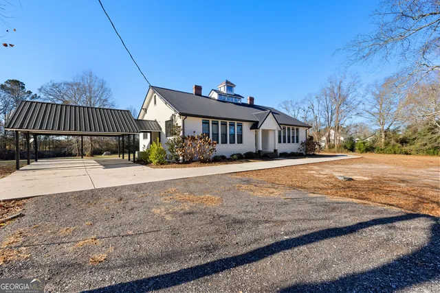 a kitchen with stainless steel appliances kitchen island granite countertop a refrigerator and a stove