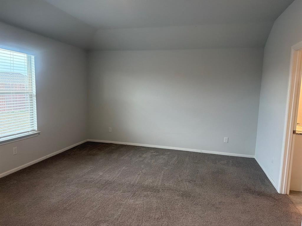 721 Durango Lane Cleburne, TX 76033 - Photo 8 of 25 an empty room with a window