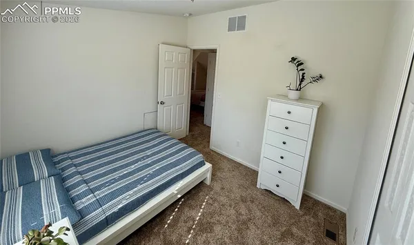 a bathroom with a sink a toilet a mirror and tub